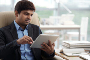 “HR manager in Noida reviewing candidate background check report from Pietos”