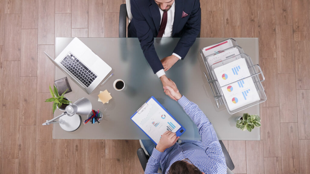Handshake representing successful and secure hiring process with background verification