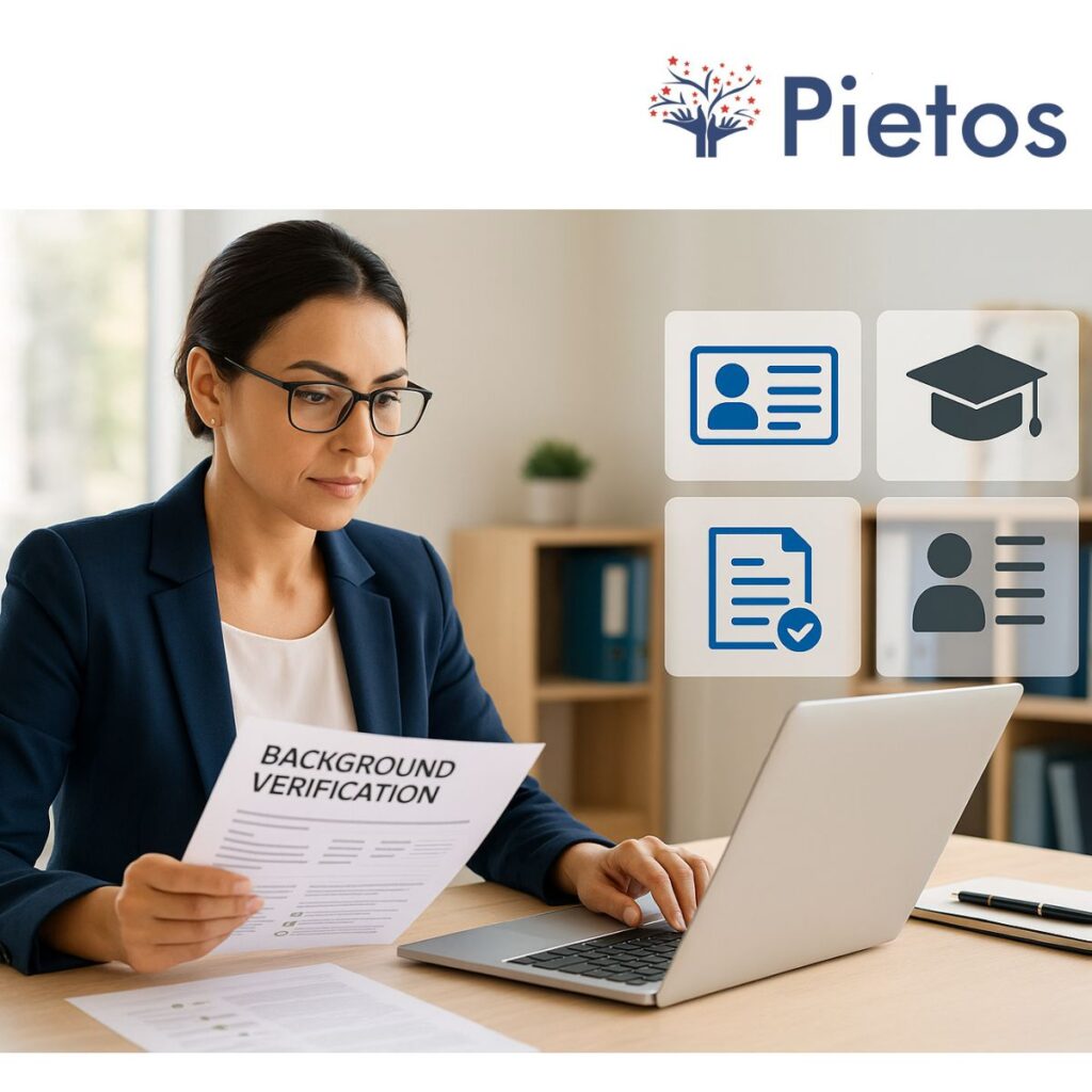 A professional recruiter reviewing background verification reports on a laptop — concept of a BGV company ensuring safe hiring.