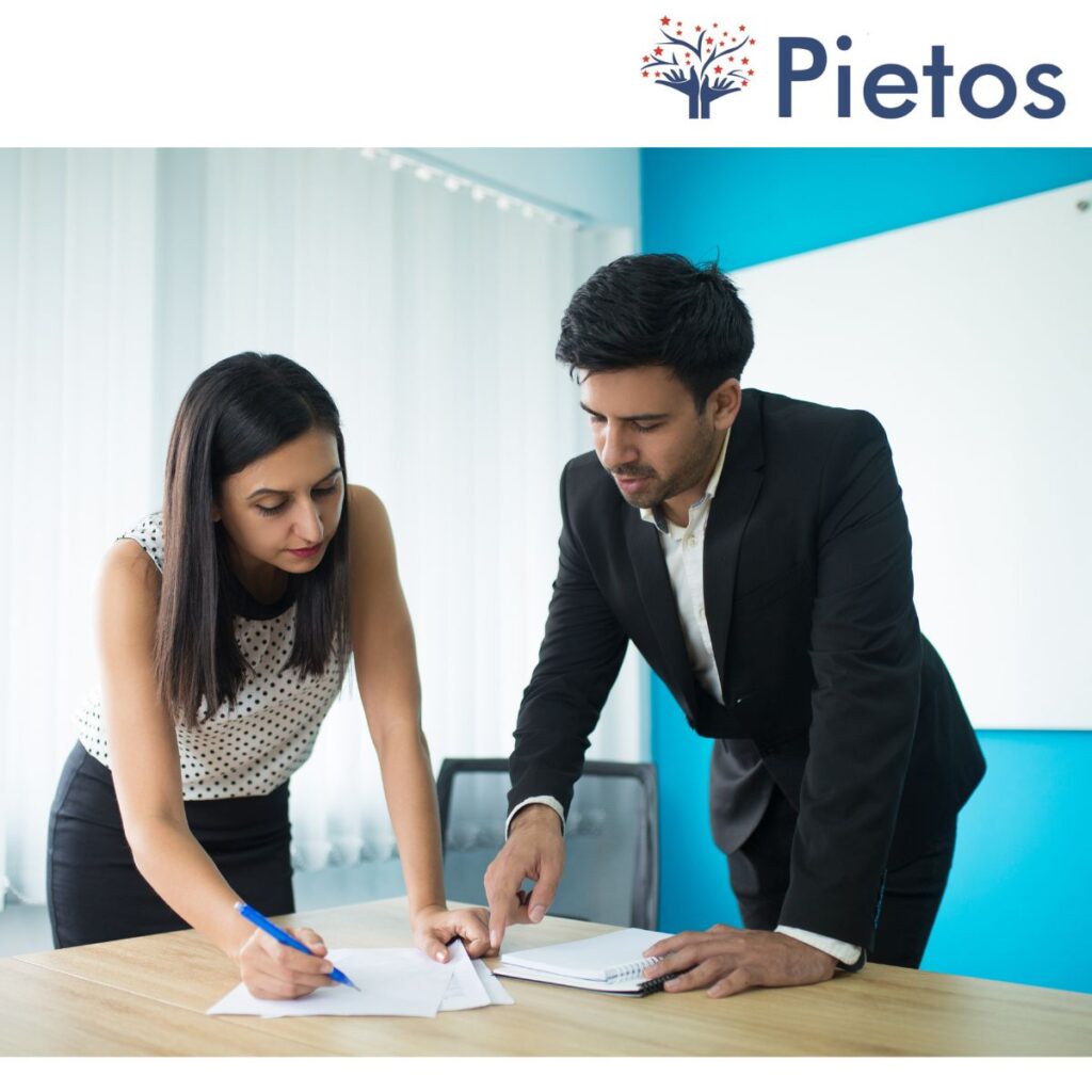 HR professional reviewing a background verification report on a laptop, representing best background verification services
